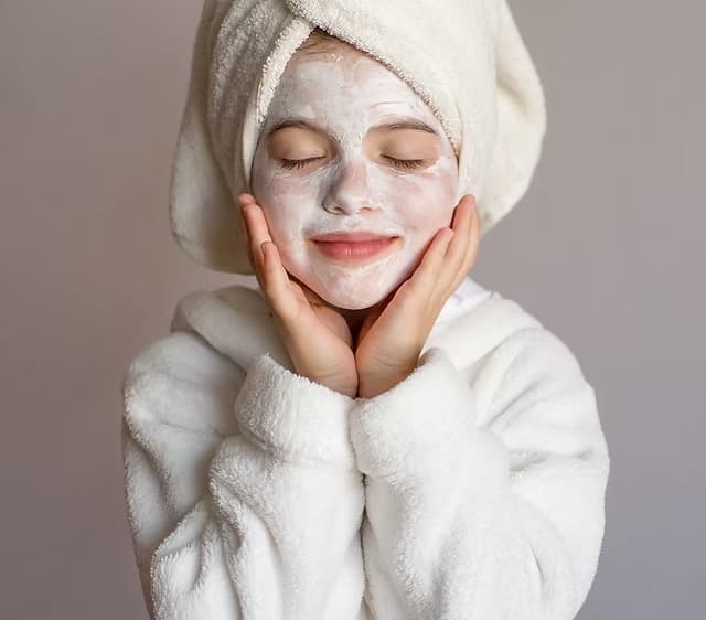 Child relaxing during a gentle mini facial and sensory spa treatment