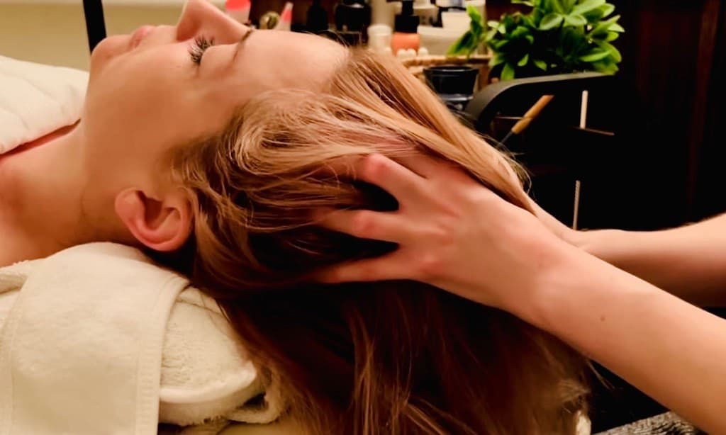 Therapist performing calming sensory hair play during upper body relaxation therapy